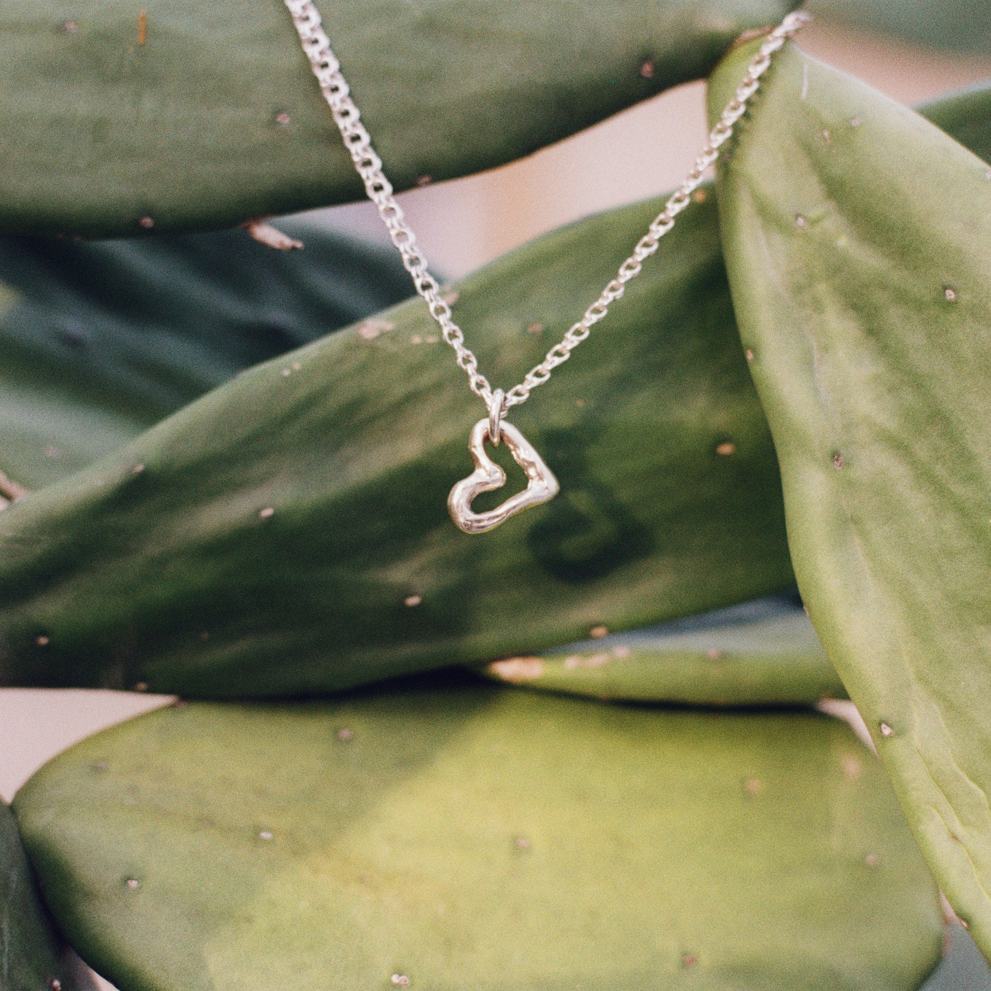 MELTED HEART LANKY PENDANT