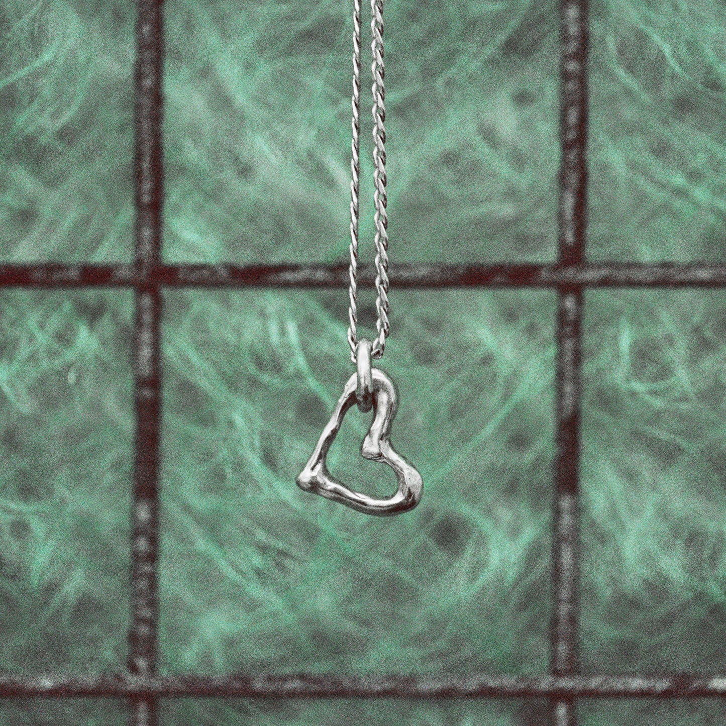 MELTED HEART LANKY PENDANT