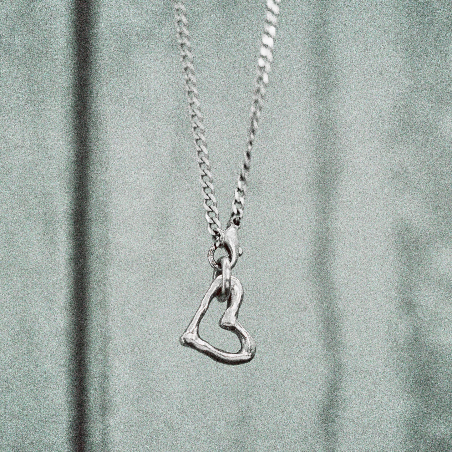 MELTED HEART LANKY PENDANT